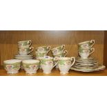 An extensive Queen Anne 'Regency' pattern tea set including 10 cups, 12 saucers, 12 tea plates,