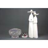 A large Lladro figure of 2 young nuns with box, H.33cm, and a Caithness paperweight together with