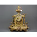 A 19th C French bronze and brass mantel clock, H. 50cm.