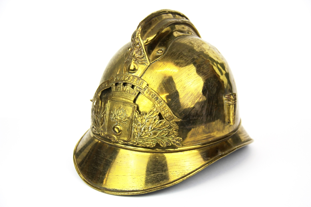 An antique gilt brass fireman's helmet.