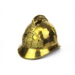 An antique gilt brass fireman's helmet.
