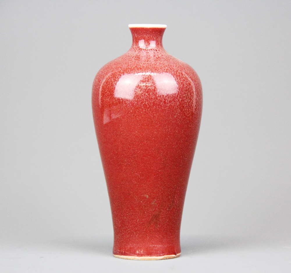 A Chinese Sang De Boeuf glazed porcelain vase, H. 15.5cm.