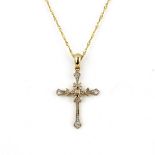 A 9ct yellow gold diamond set cross pendant and chain, L. 3cm.