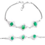 A 925 silver bracelet set with oval cut emeralds and white stones, L. 17cm.