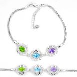 A 925 silver bracelet set with oval cut amethyst, blue topaz and peridot, L. 17cm.