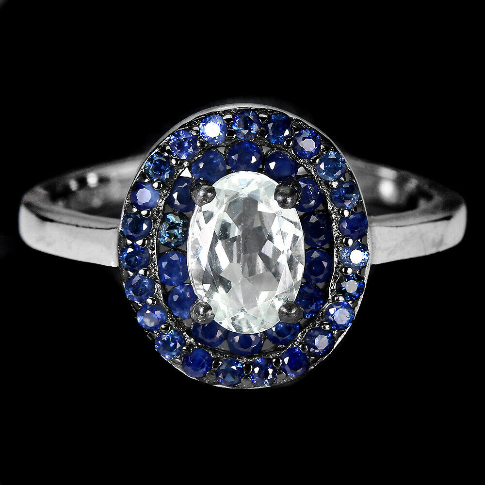 A matching 925 silver ring set with oval cut aquamarine and sapphires, (N.5).