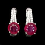 A pair of 925 silver earrings set with swiss cut rubies and white stones, L. 1.4cm.