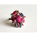 A 925 silver ring set with rubies and sapphires, (O).