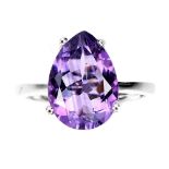 A 925 silver ring set with a pear cut amethyst, (O).