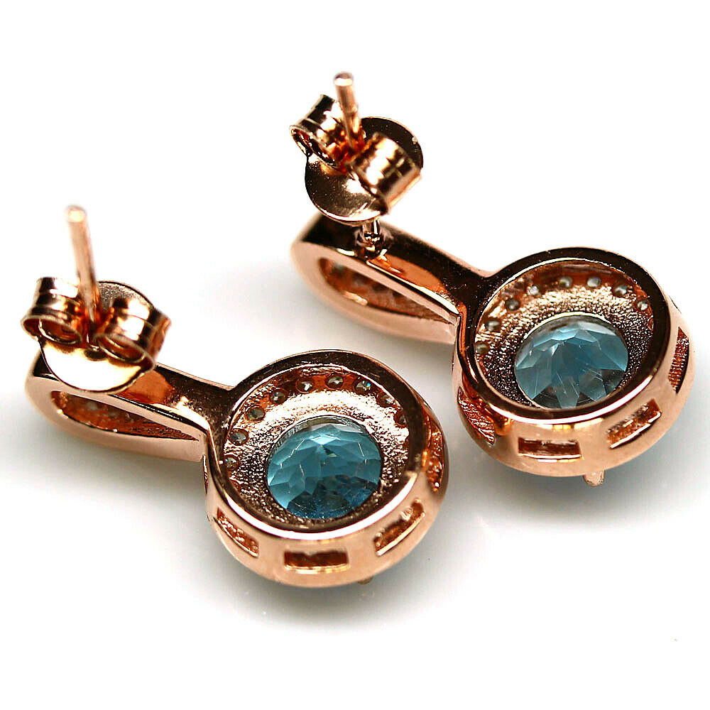 A pair of 925 silver rose gold gilt earrings set with sky blue topaz and white stones, L. 2cm. - Image 2 of 2