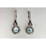 A pair of 925 silver drop earrings set with blue topaz and white stones, L. 3.5cm.