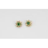 A pair of 9ct yellow gold emerald and diamond set cluster earrings, Dia. 0.7cm.