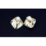 A pair of 14ct yellow gold (stamped 14k) pearl set metamorphic stud earrings, L. 2cm.