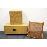 Two Lloyd Loom linen baskets and a vintage cane and wood bed support.