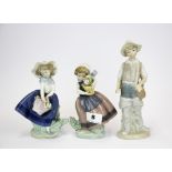 A group of three Lladro figurines, tallest 23cm.