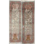 A pair of Eastern hand woven silk rugs, 127 x 45cm.