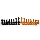 A vintage turned wooden chess set, king H. 9cm. One pawn missing.