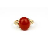 A 9ct yellow gold ring set with cabochon cut cornelian, (M.5).