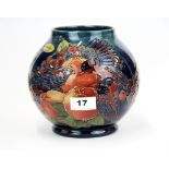 A Moorcroft tube -lined bird and pomegranate pattern vase, H. 17cm. Dia. 18cm.