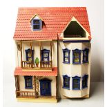 A large vintage wooden dolls house and contents, 54 x 69 x 41cm.