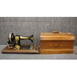 A mahogany cased antique Jones sewing machine.