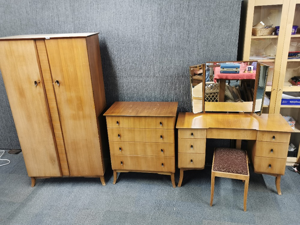 A 1960's light mahogany two door wardrobe, W. 95cm. together with a matching dressing table and - Image 2 of 5