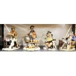 A group of four large Capodimonte porcelain figurines (two appear to be A/F).