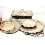 A group of five silver plated trays and salver together with a silver plate and glass serving