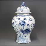 A 19th/ early 20th Century Chinese incised and hand painted porcelain jar and lid, H. 35cm.