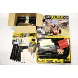 A vintage boxed Scalextric racing car set and accessories.