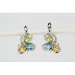 A pair of 925 silver earrings set with pear cut citrine, peridot and blue topaz, L. 2.1cm.