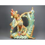 A hand painted Balinese carved wooden figure of a dancer, H. 50cm.