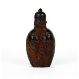 A Chinese carved cattle horn double fish snuff bottle, H. 8cm.