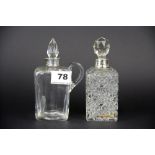 Two hallmarked silver mounted dressing table bottles.
