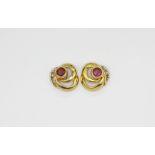 A pair of 9ct yellow gold stud earrings set with rubies and diamonds, L. 1cm.