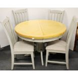 A contemporary extending circular dining table together with four painted finish dining chairs, Dia.