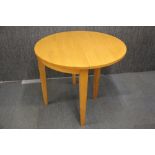 An 1970's semi-circular fold out tea table, Dia. 91cm.