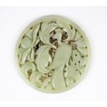 A Chinese pale celadon nephrite jade panel (probably from a box lid), Dia. 9.5cm.
