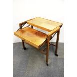 A 1960's metamorphic veneered tea trolley/table, 78 x 38cm.