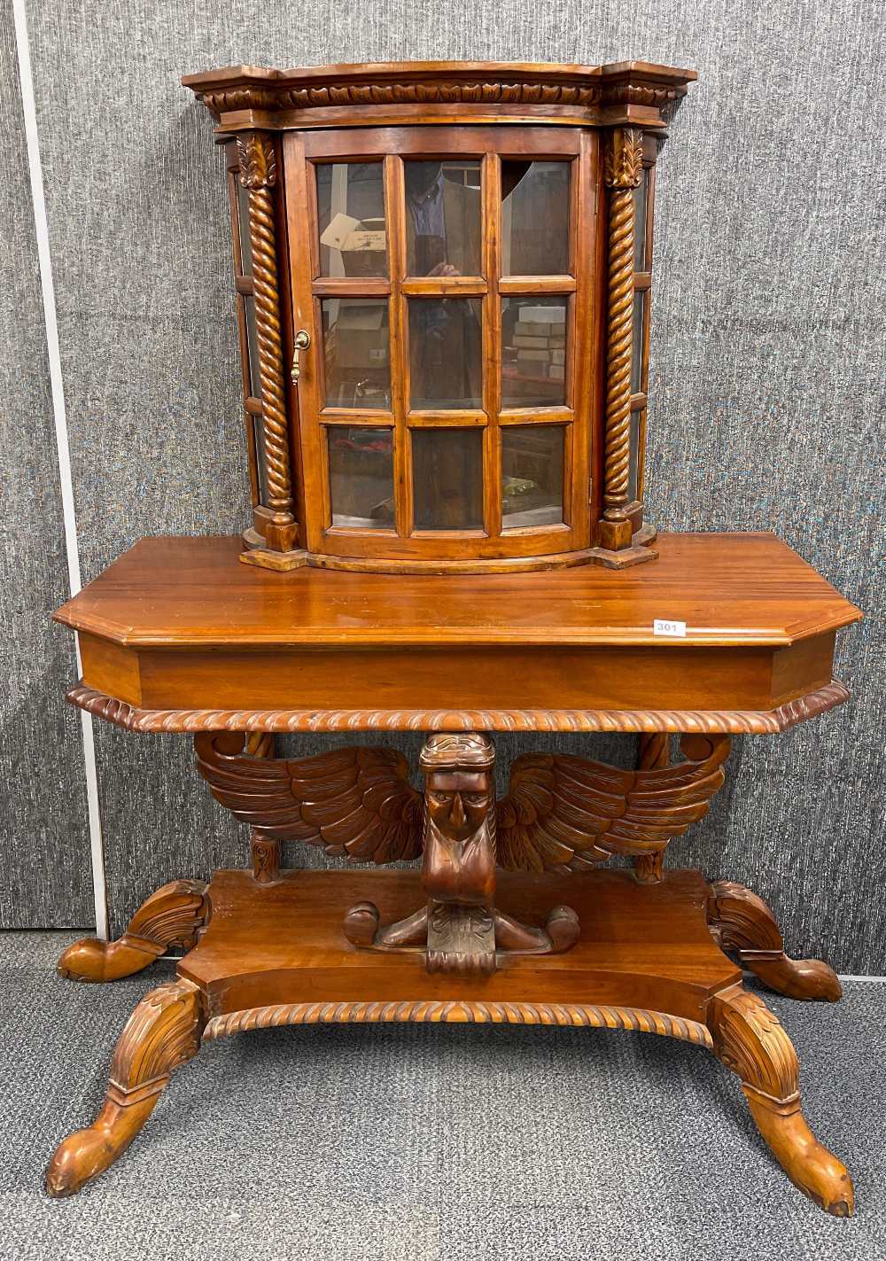 An unusual mahogany side table cabinet, W. 109cm. H. 155cm. Condition: one back leg currently