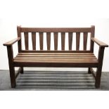 A hardwood garden bench, W. 128cm.