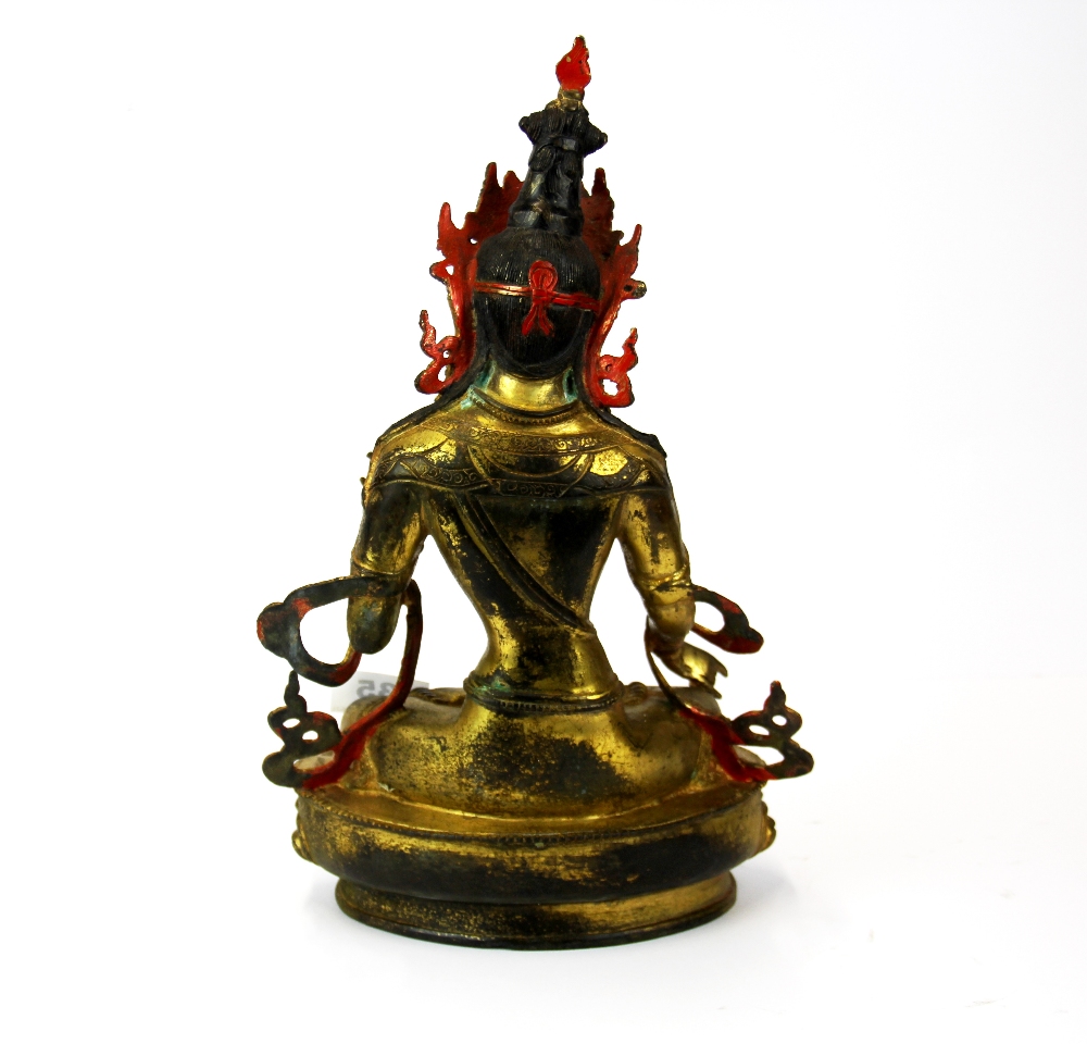 A Tibetan temple quality figure of a seated Tara with hand painted face, H. 34cm. - Bild 2 aus 4