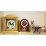 A silver plated nut bowl and two Quartz mantle clocks, tallest 35cm.