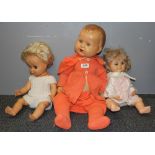 A large composition child doll, H. 63cm. and two others.