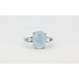 A matching 925 silver ring set with cabochon cut aquamarine, (L).