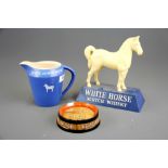 A White Horse Whiskey plastic advertising figure and a White Horse jug together with a Guinness