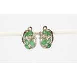 A pair of 925 silver earrings set with emeralds and white stones, L. 1cm.