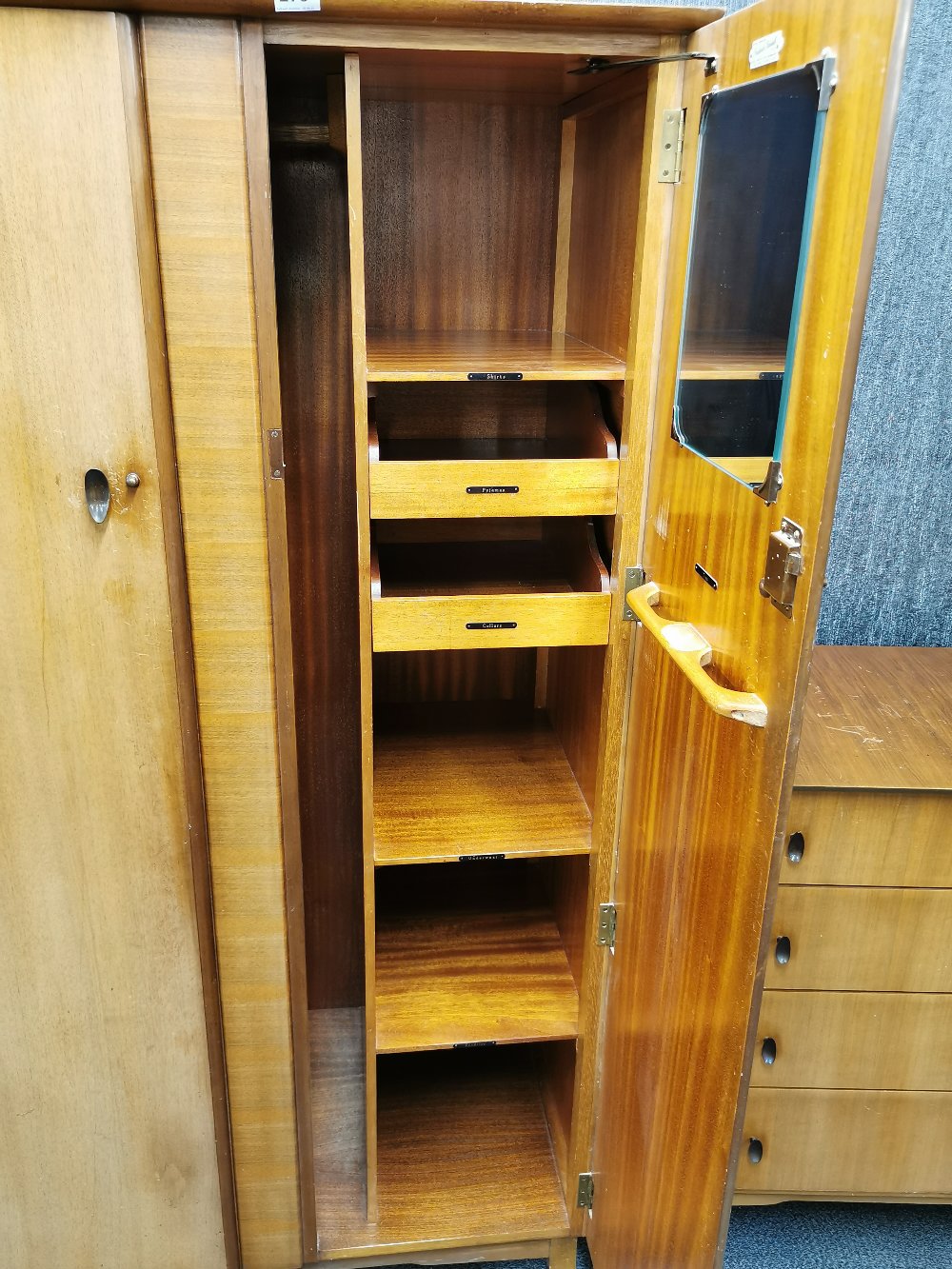 A 1960's light mahogany two door wardrobe, W. 95cm. together with a matching dressing table and - Image 5 of 5