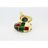 A 925 silver gilt enamelled fish shaped ring, set with oval cut sapphire and ruby eyes, (P).