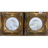 A pair of gilt framed relief moulded panels, frame size 31 x 31cm.